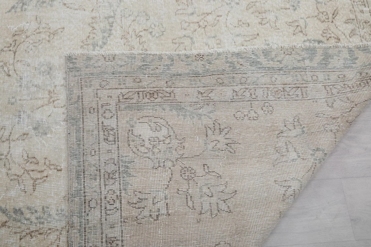 Close-up of the rug's back, revealing the hand-knotted construction and foundation details