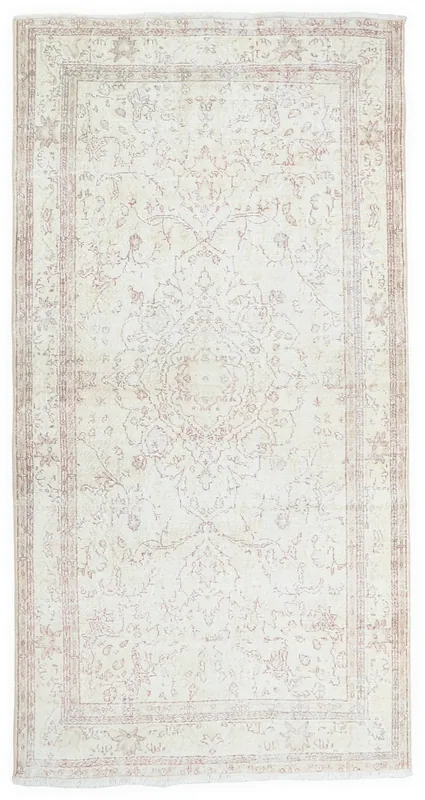 Full top view of the 5'5" x 8'10" ivory and rose vintage Anatolian rug on a white background.