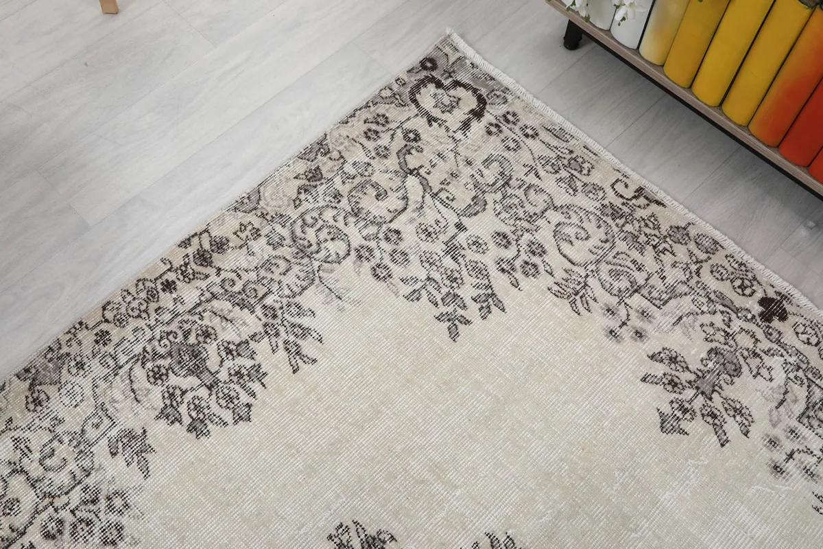 Corner detail of the rug's border pattern and the gentle color variation