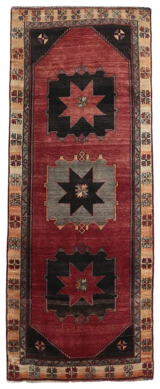 Full overhead view of the Red Geometric Star Vintage Rug on a white background