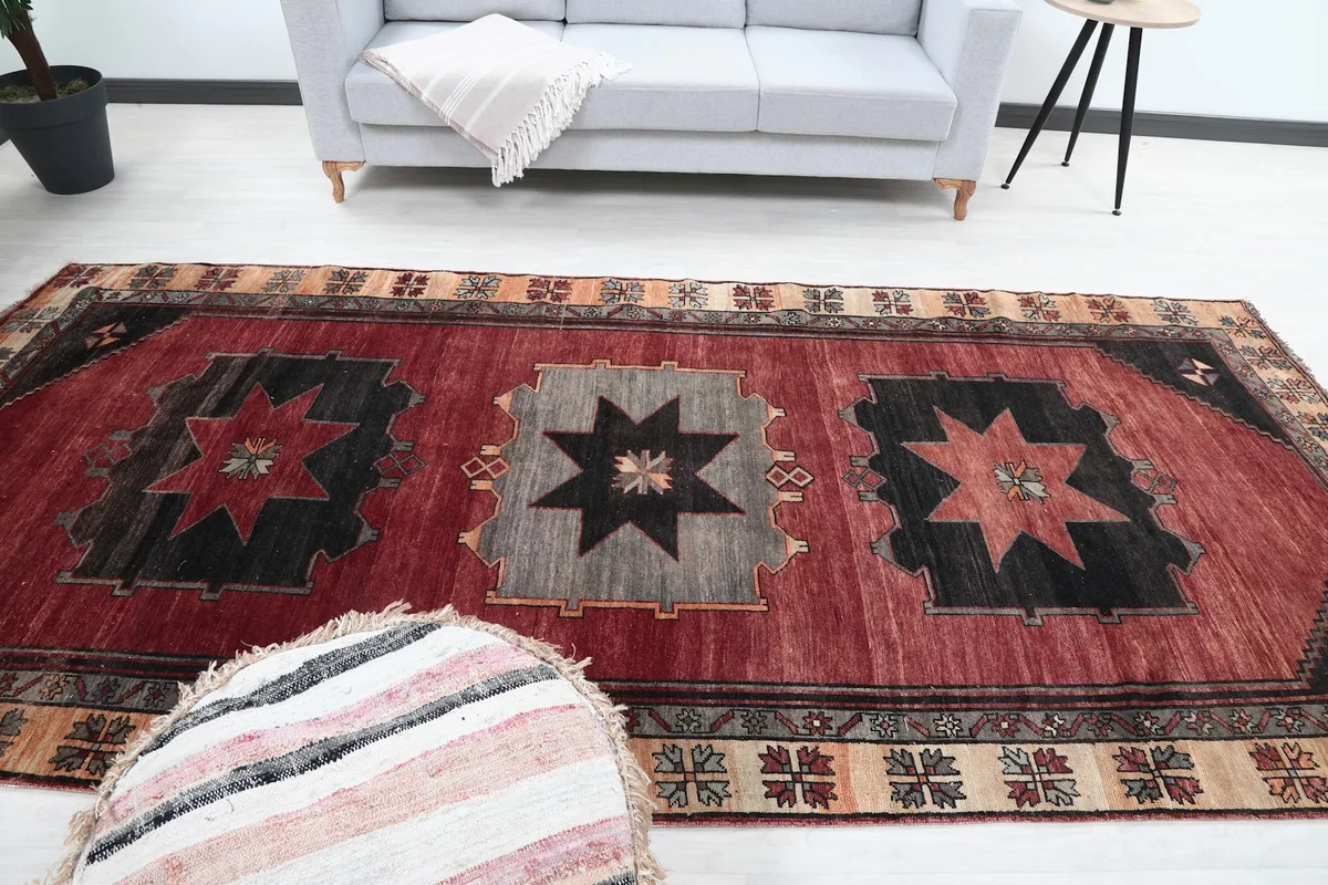 Overhead view of the red rug in a room, showcasing its placement and size