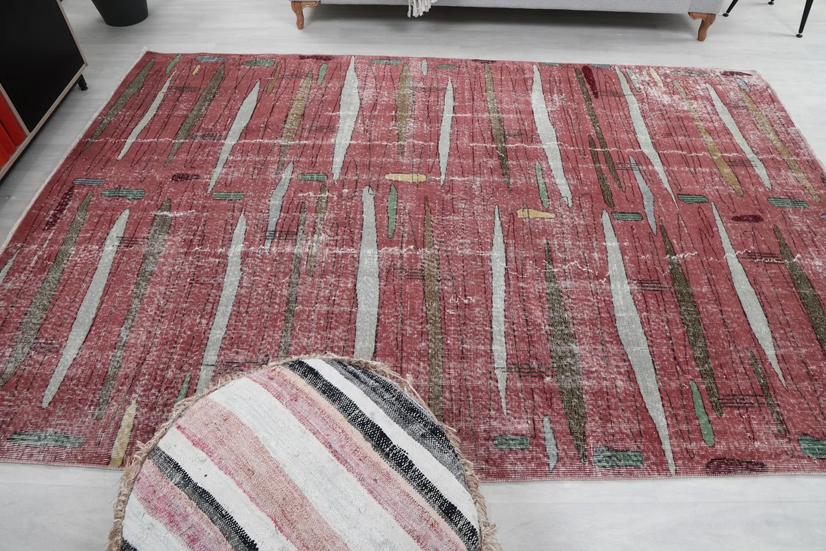 Overhead room view emphasizing the rug's central placement and its unique abstract design.