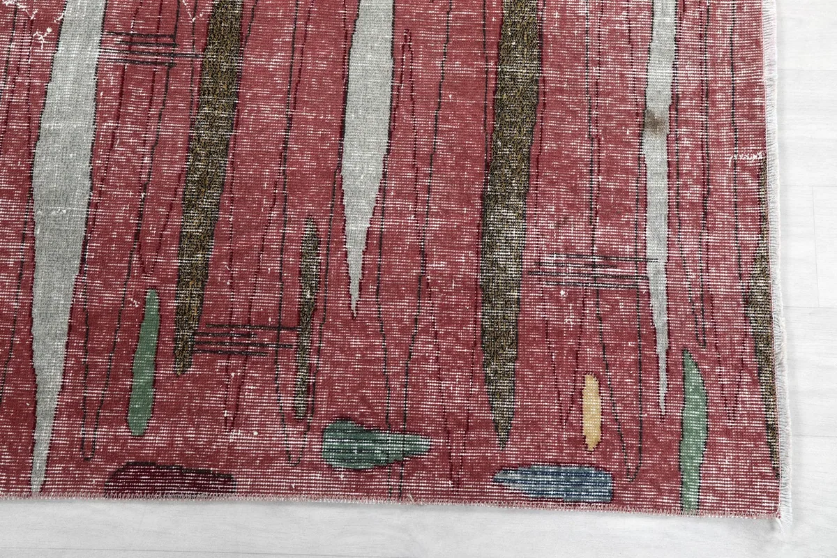 Detailed view of the rose field with gray, green, and gold abstract brushstroke motifs.