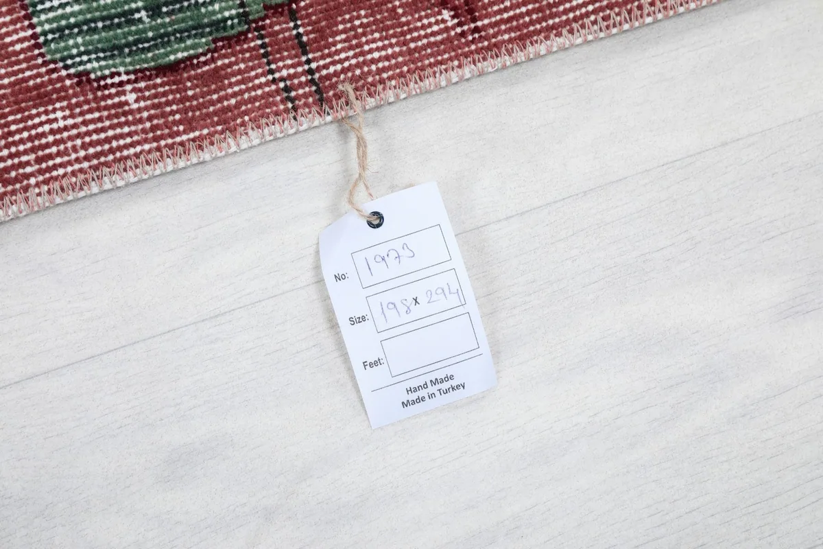 Product tag showing the dimensions and 'Hand Made in Turkey' for the vintage Anatolian rug.