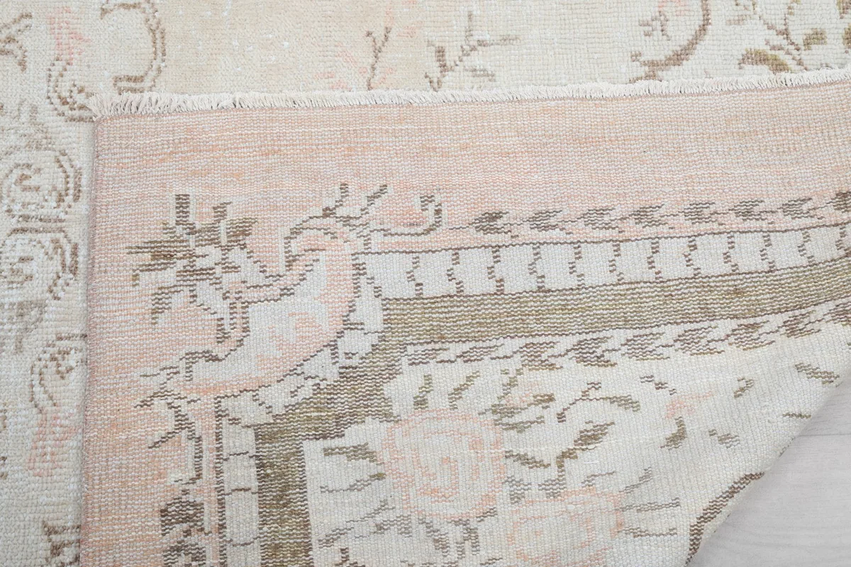 Underside of the rug, revealing the hand-knotted construction and foundation