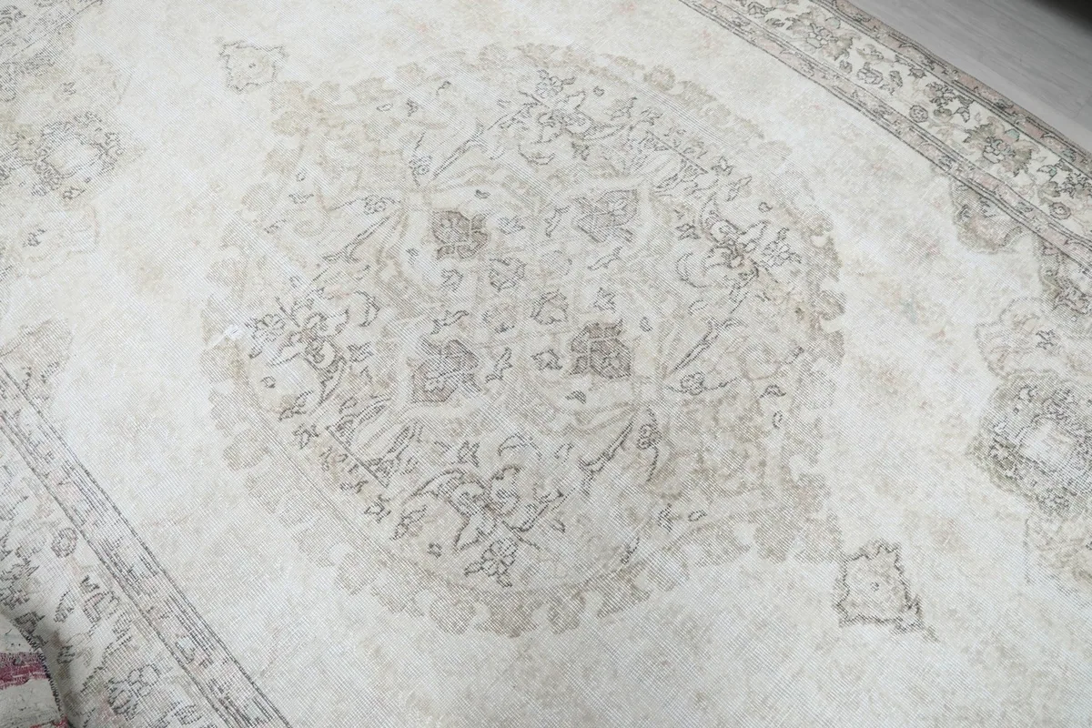 Close-up of the central medallion design, showing the intricate floral motifs and subtle color variations
