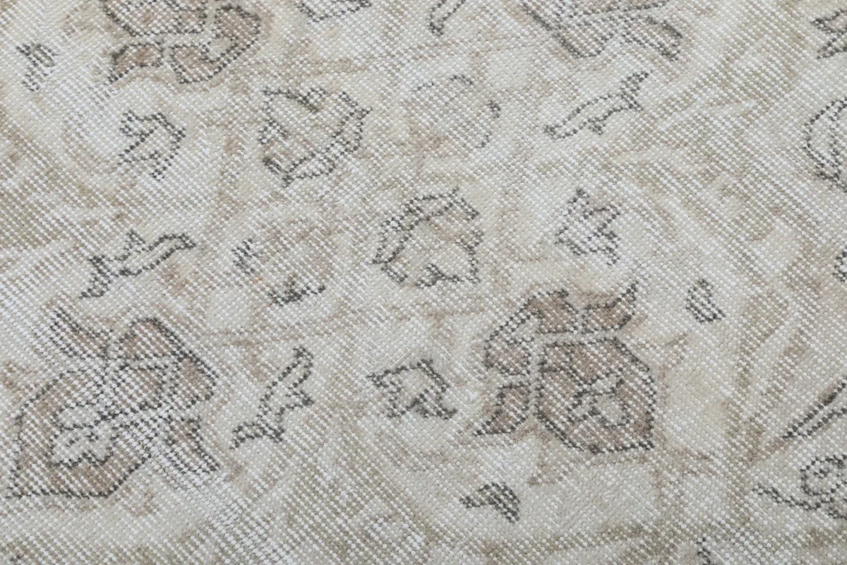 Texture shot of the low wool pile and individual knots, revealing the vintage wear and character