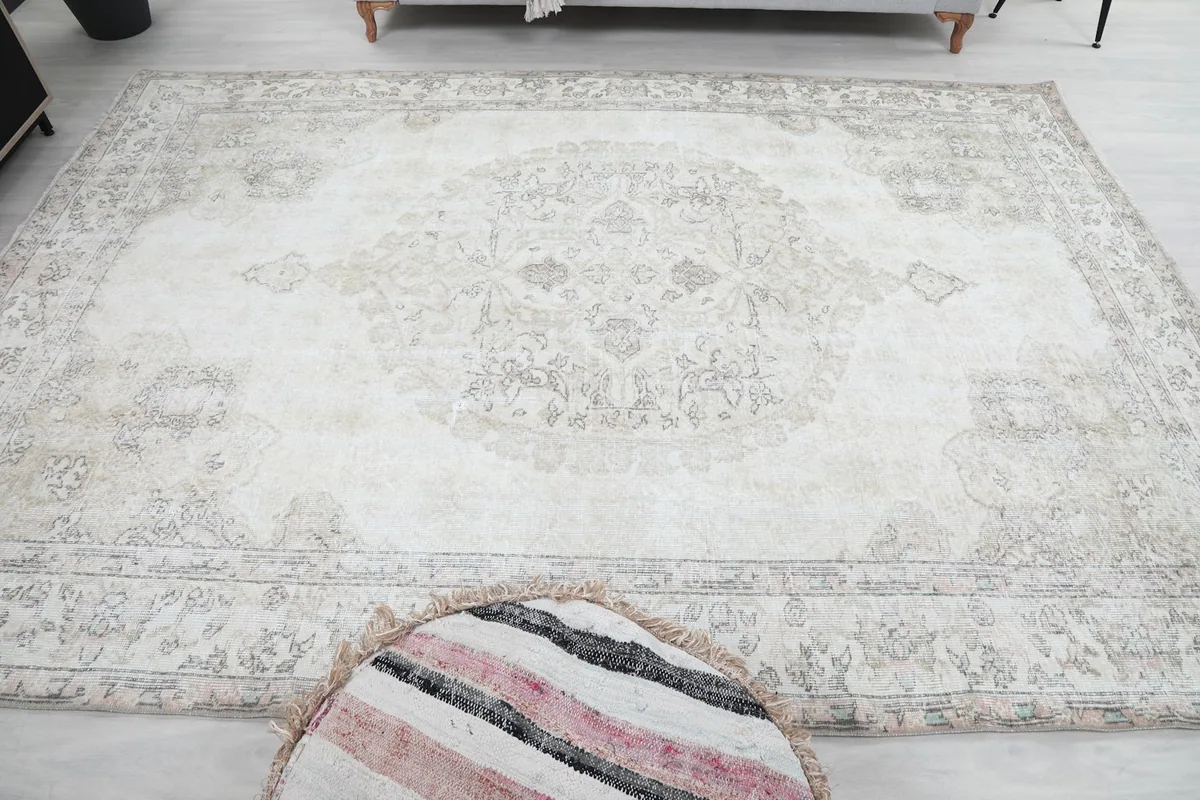 Direct overhead view of the rug on the floor, capturing the full medallion and field design