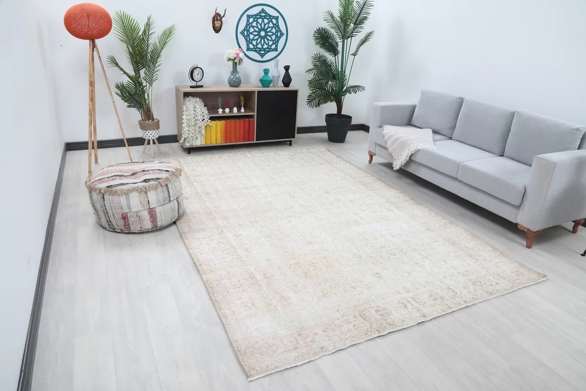 Angle view of the large beige area rug in a modern living space, showcasing its size and placement.