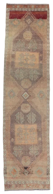 Full top view of the vintage Anatolian runner rug with beige, rust, and gray geometric patterns