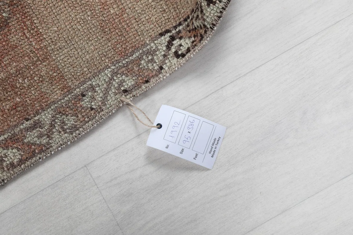 Product tag attached to the rug, displaying item information and origin