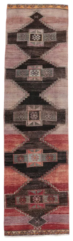 Full top view of the vintage Anatolian runner with rose, red, black, and gray geometric patterns.