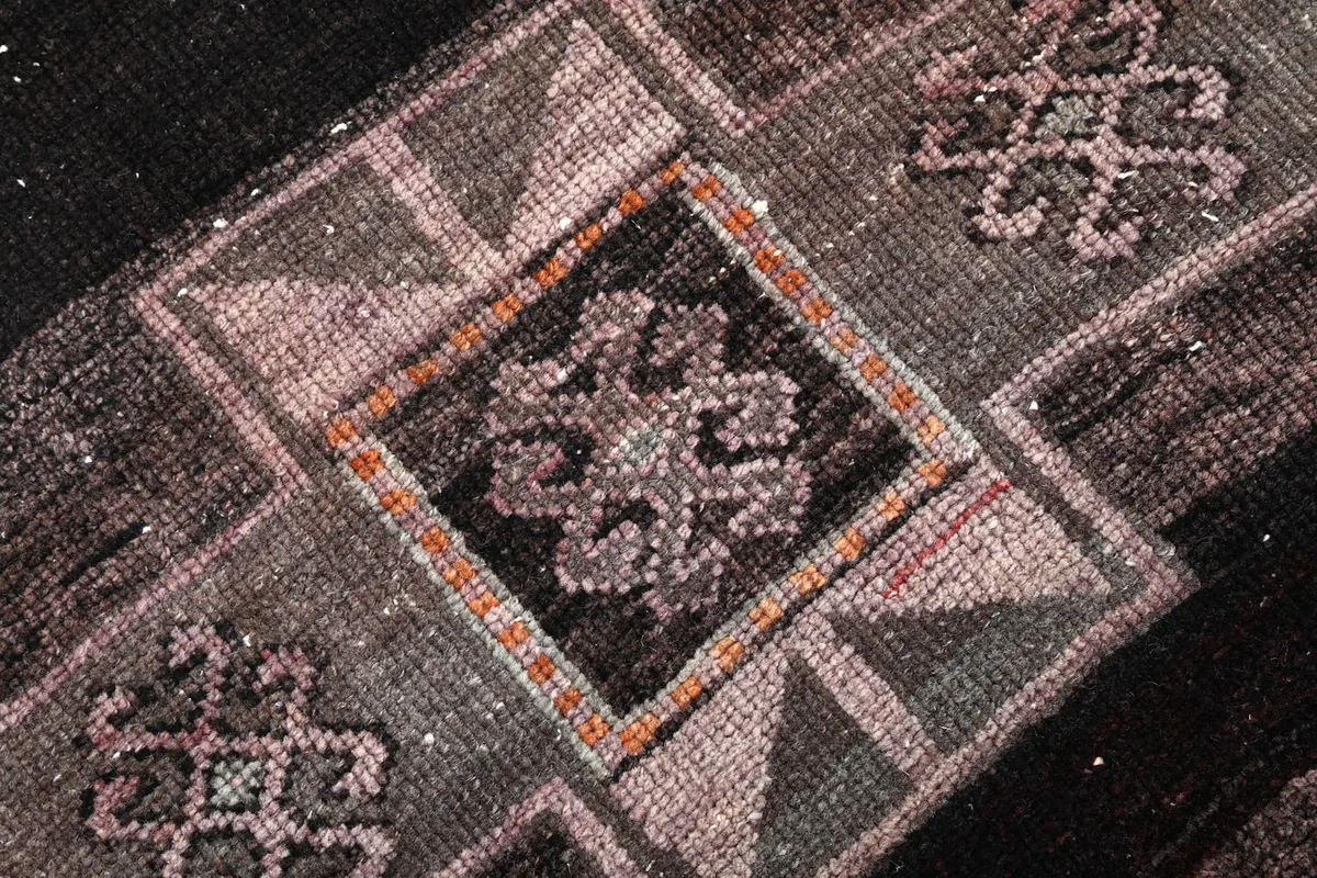 Detailed close-up of a central geometric medallion with intricate patterns and color blending.