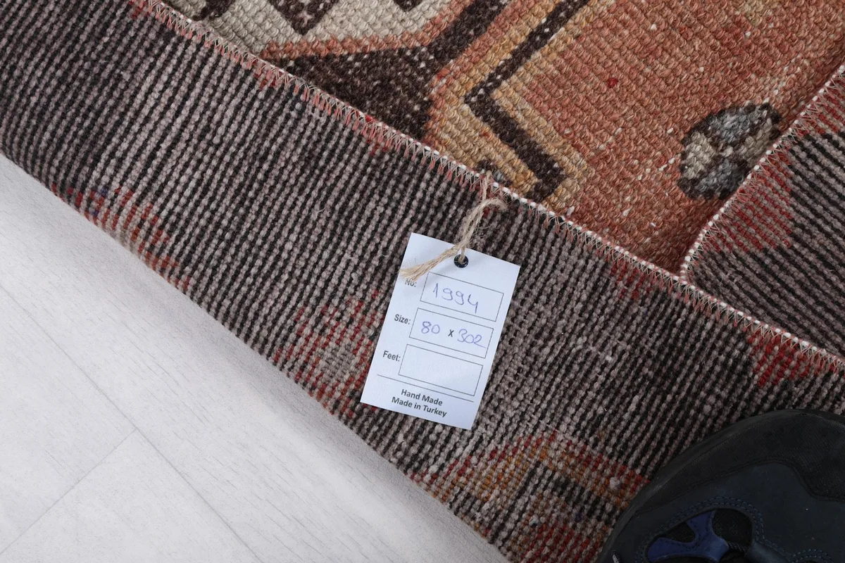 Corner of the rug with a tag displaying product information and size