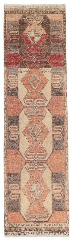 Full top view of the rust, beige, and brown vintage Anatolian runner rug with geometric patterns