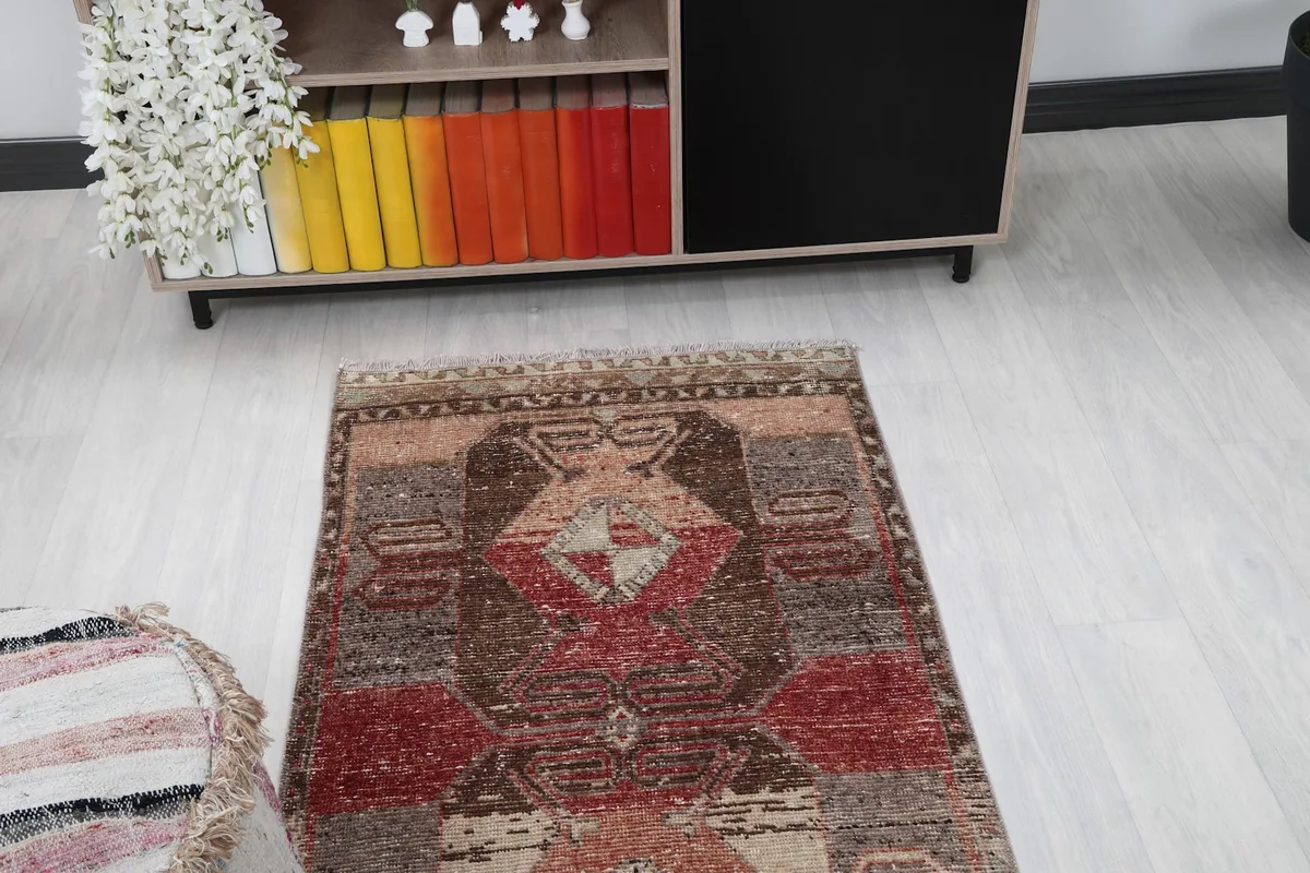 View of the rug from the top end, showing its placement in a room with home decor items
