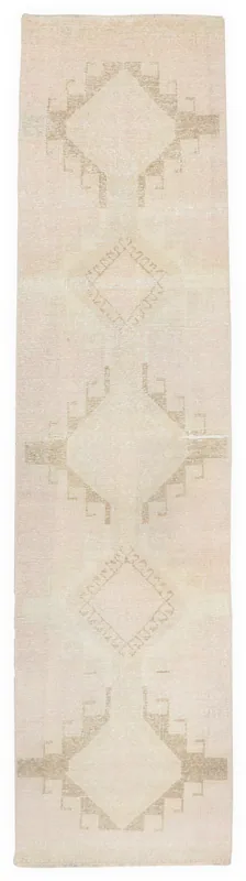 Full overhead view of the beige and tan geometric vintage Anatolian runner rug