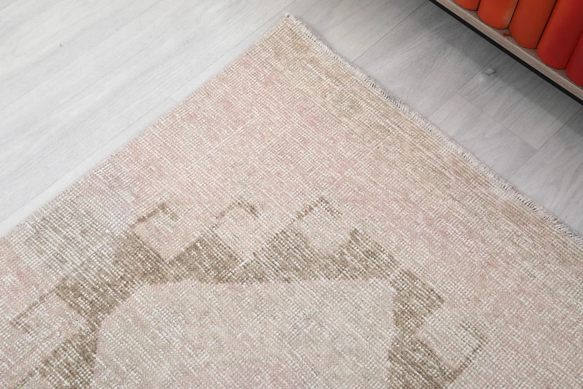 Corner detail of the runner rug, highlighting the subtle color shifts and geometric lines