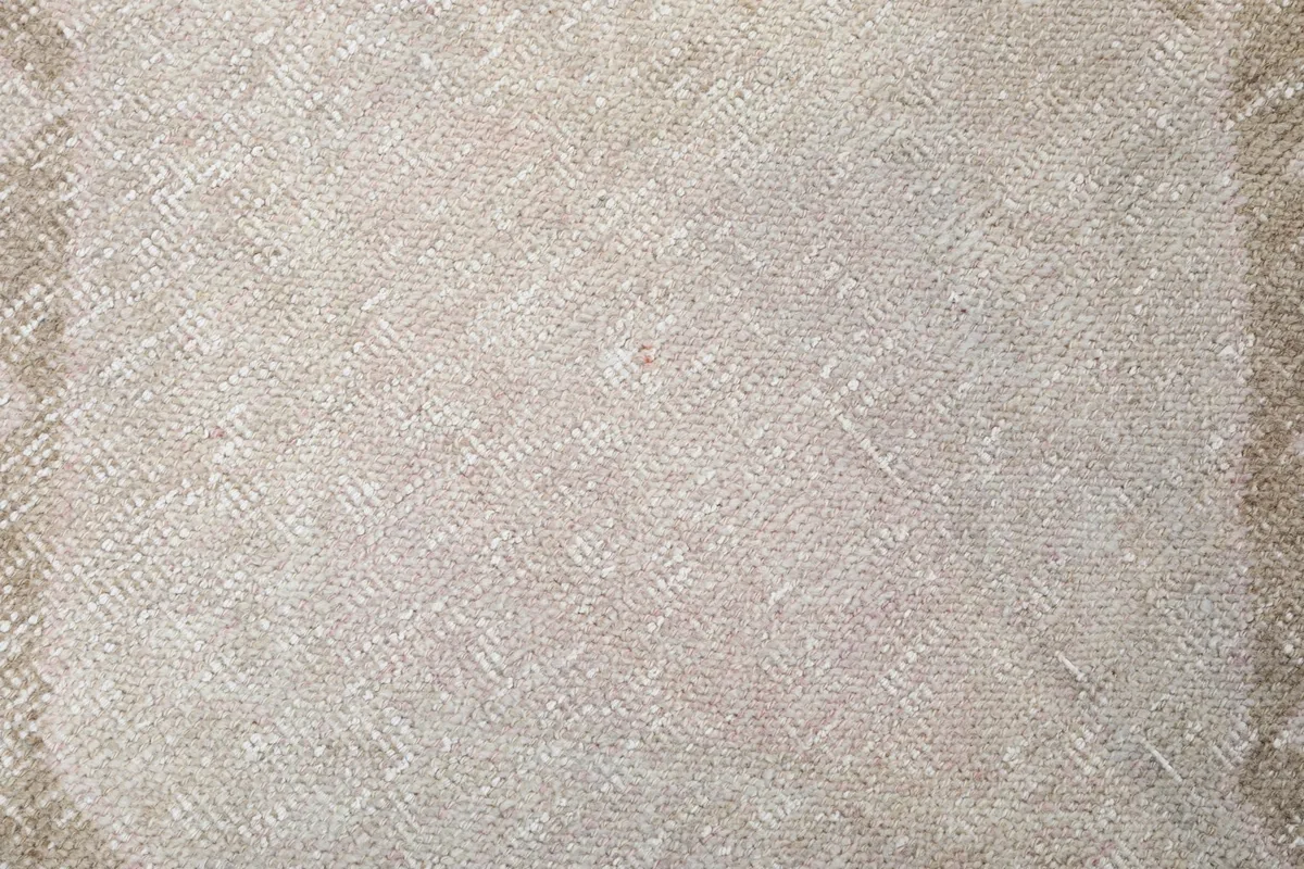 Extreme close-up of the low wool pile texture and weave of the vintage runner