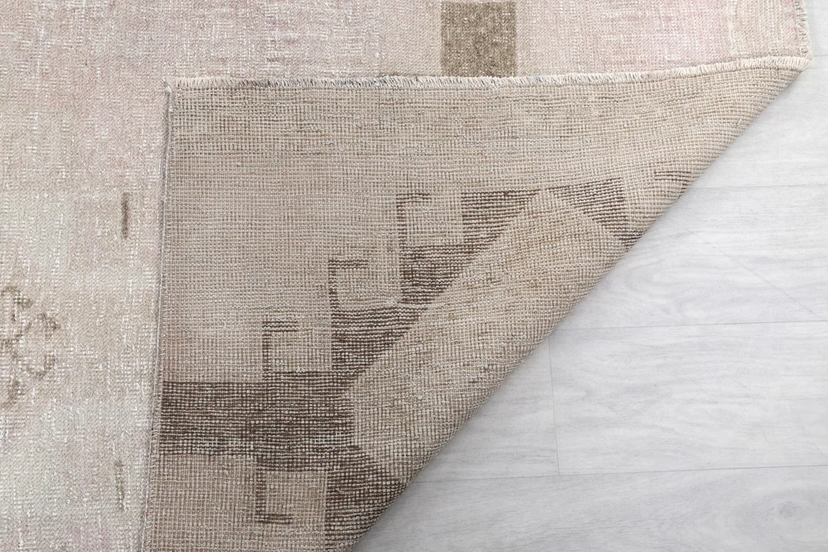 Another view of the rug's back, revealing the intricate hand-knotting and foundation