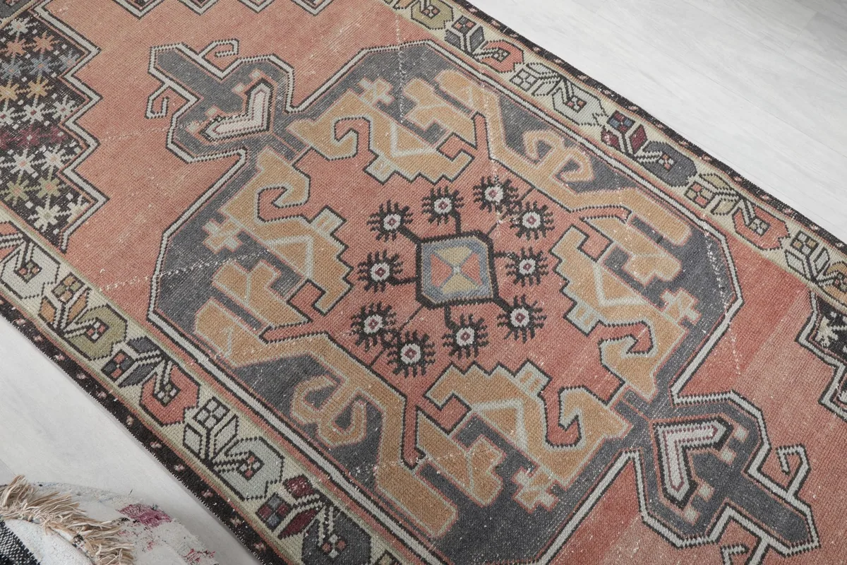 Overhead angled view highlighting the central medallion and surrounding geometric shapes of the runner