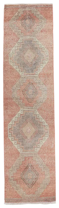 Full overhead view of the rust runner rug with geometric tribal motifs