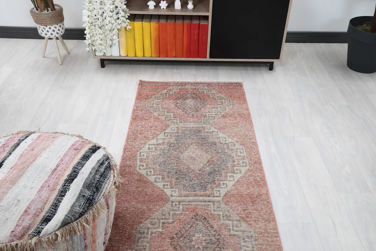 Overhead view of the rug from one end, showing its length in the room