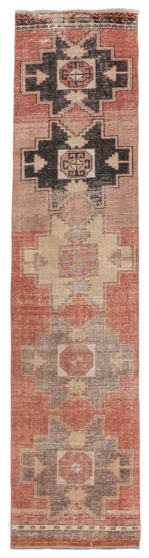 Full top view of the rust and black geometric Anatolian runner on a white background.