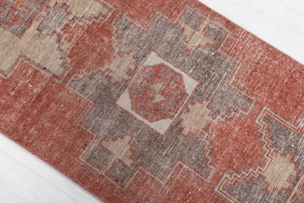 Overhead angle view of the middle section of the runner, showing tribal patterns and color variations.