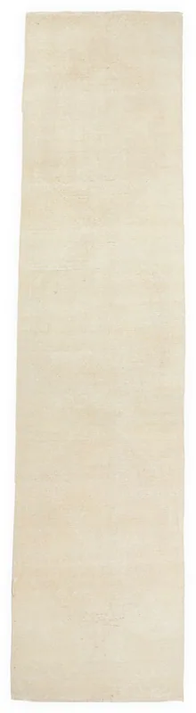 Full overhead view of the 2'11" x 12'6" ivory vintage runner rug on a white background