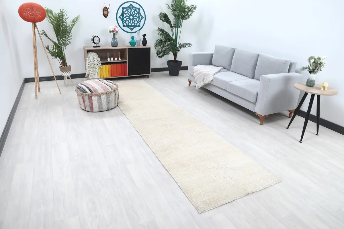 Angle view of the ivory runner rug extending through a contemporary living space