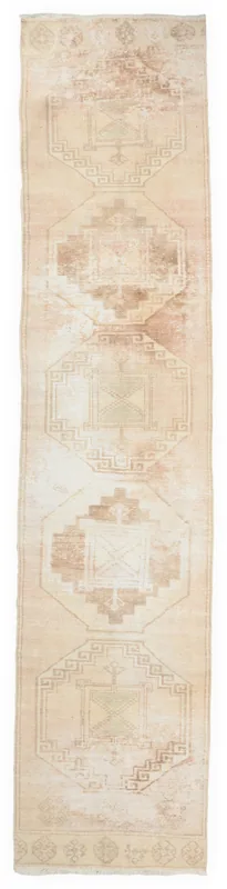 Full top view of the 2'9" x 12'2" beige and tan geometric vintage runner rug on a white background.