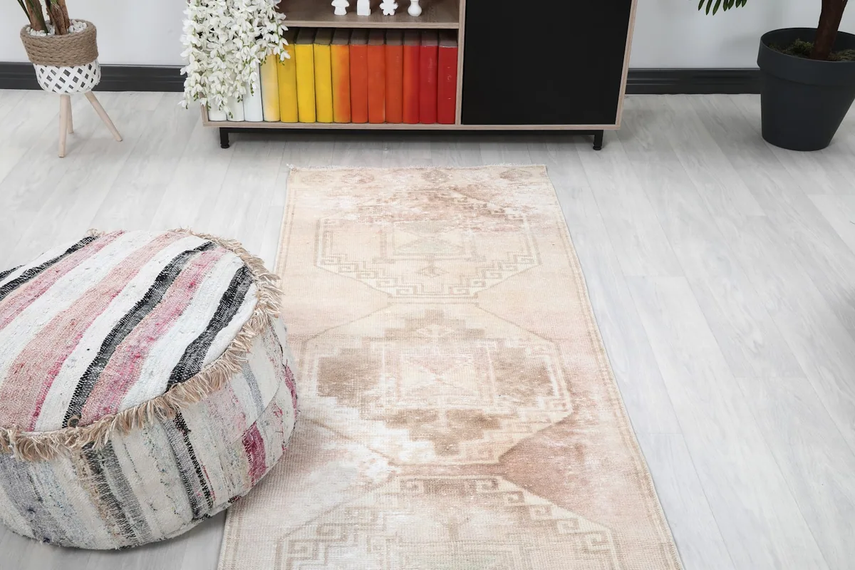 View of the runner rug stretching through a living area, demonstrating its long shape.