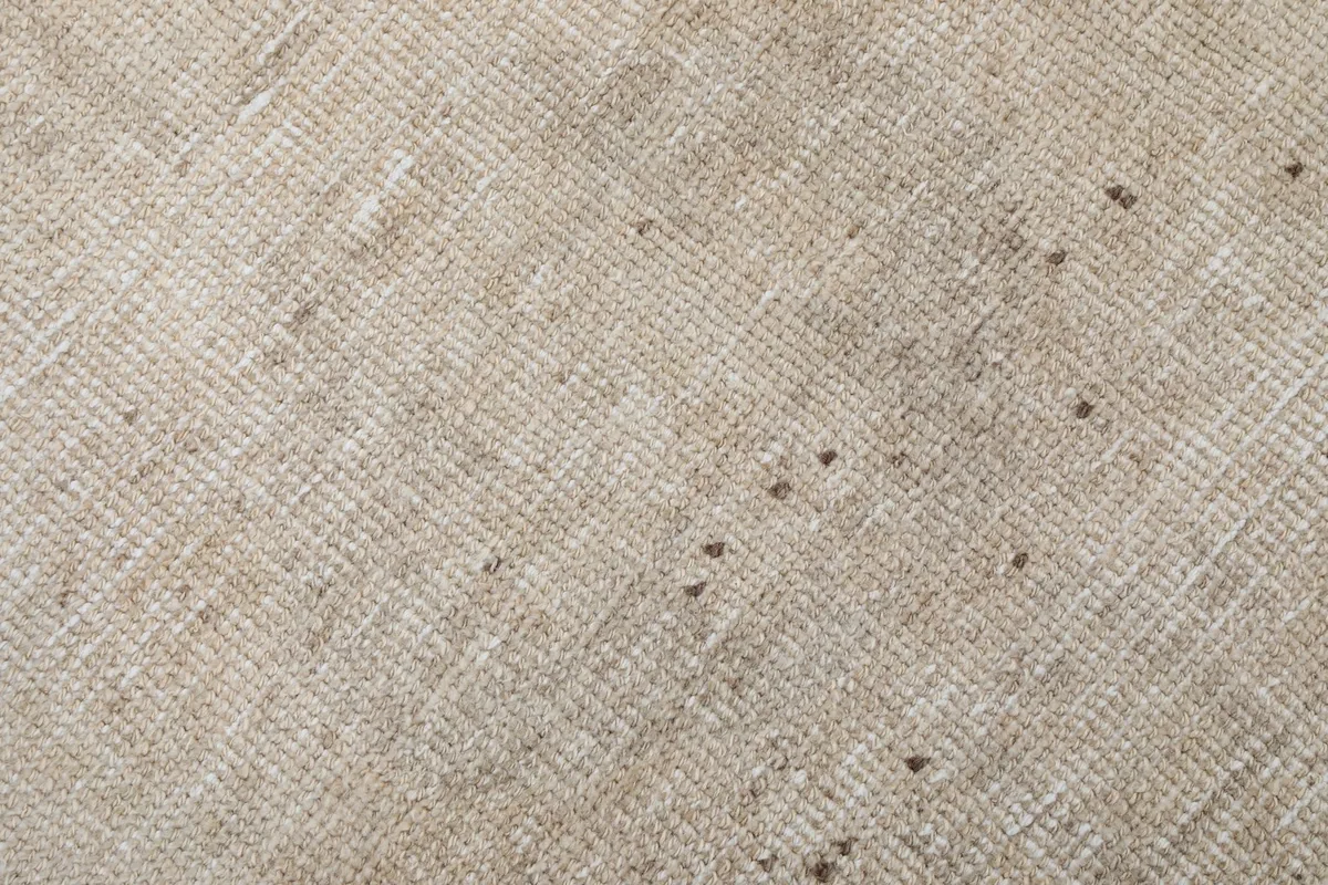 Close-up of the low wool pile and hand-knotted texture of the rug