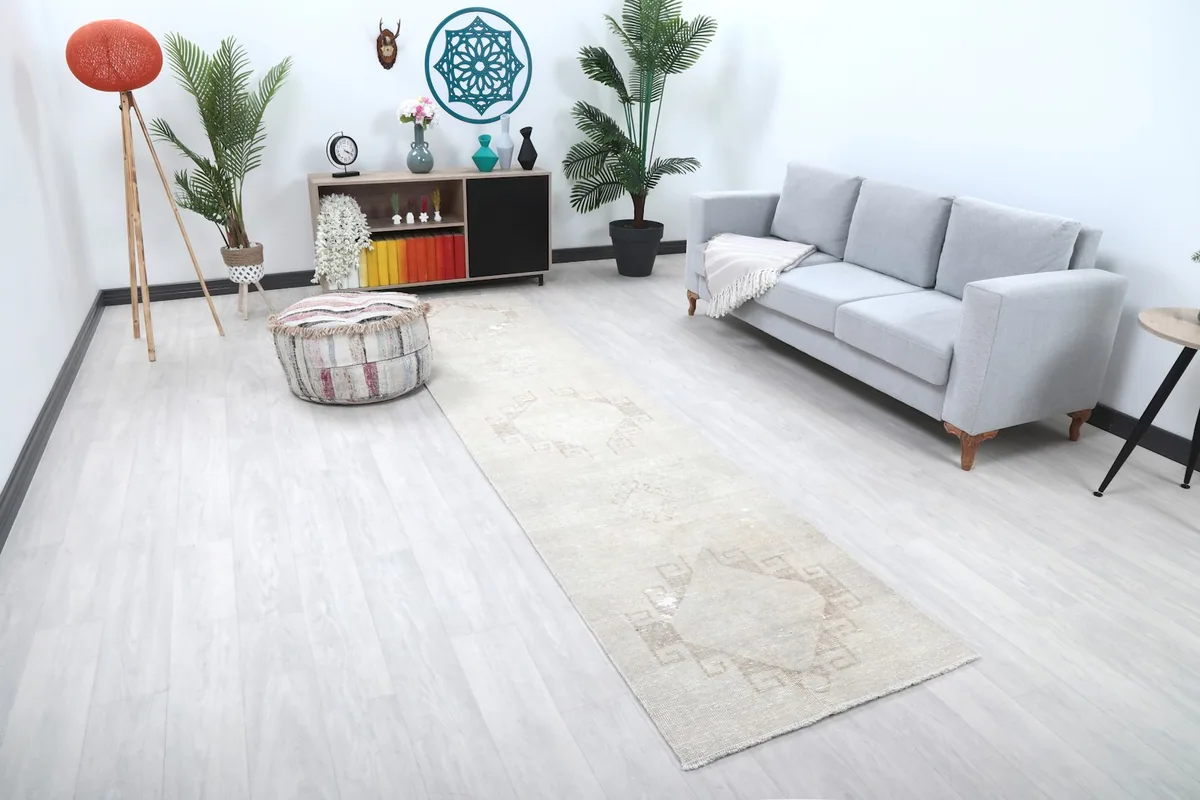 Angled view of the runner rug placed in a light-filled room with contemporary furniture