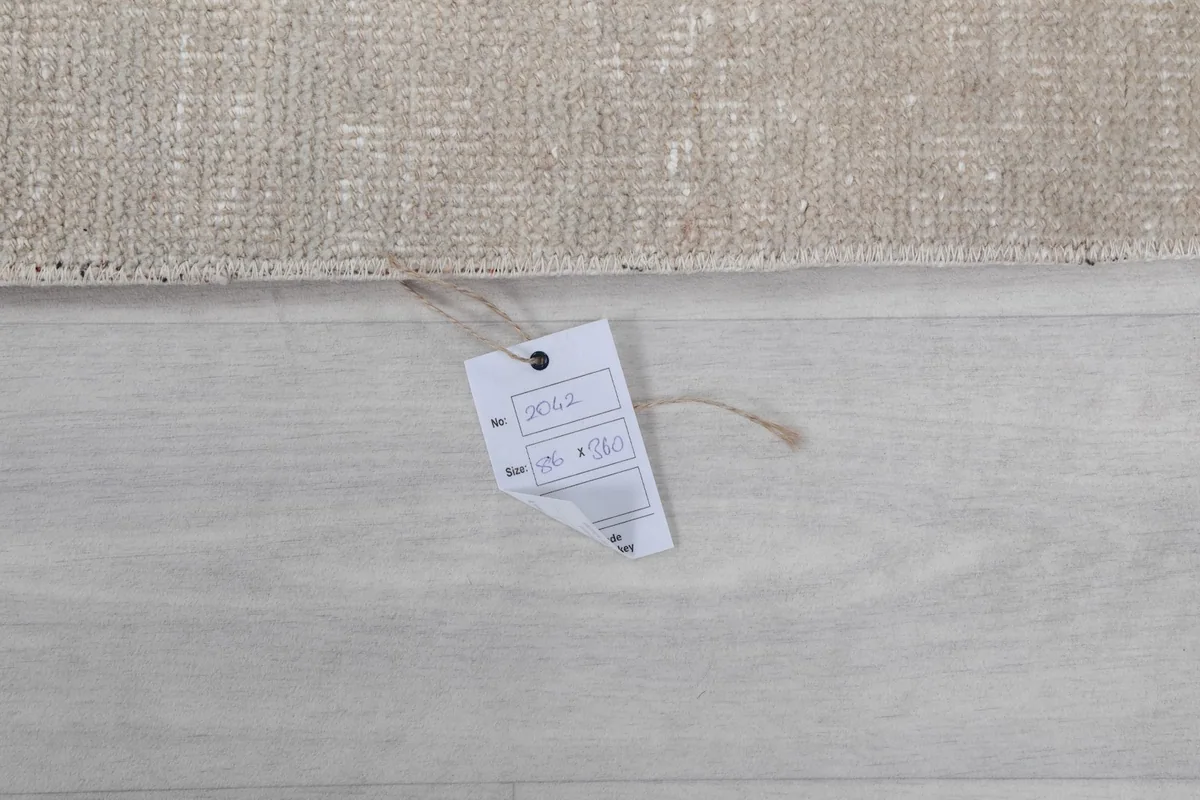 Close-up of the product tag displaying the rug's size and identification details