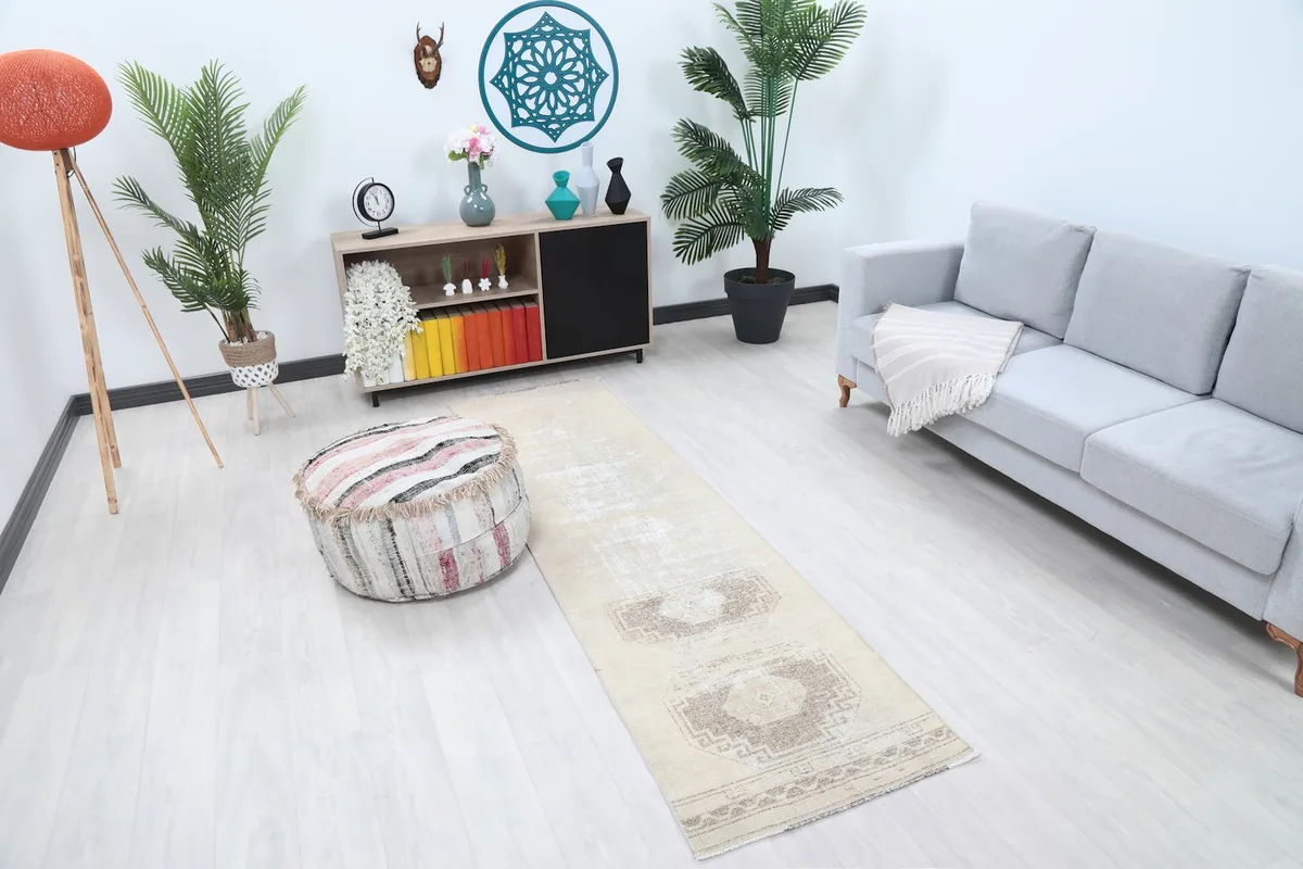 Overhead view of the distressed vintage runner rug in a room with a sofa and decor