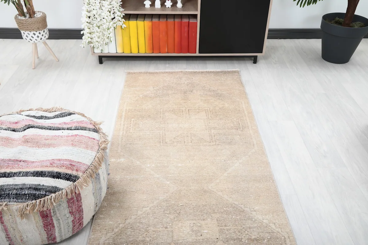 Overhead view of the vintage runner rug in a room setting, emphasizing its placement and length