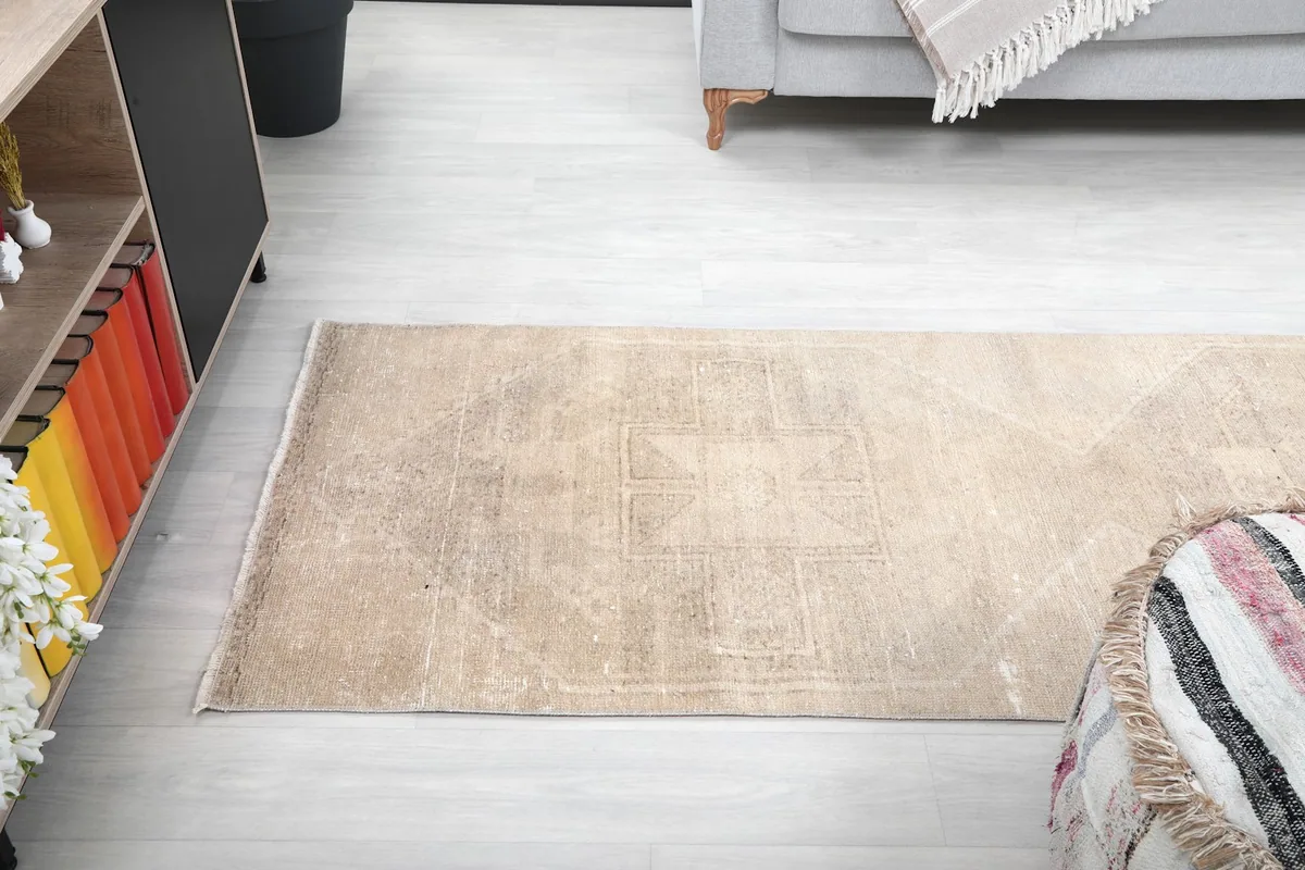Overhead shot of the runner rug in a room, capturing its full length and the understated geometric design