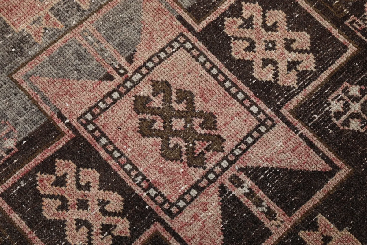 Extreme close-up of a central tribal motif within the geometric design