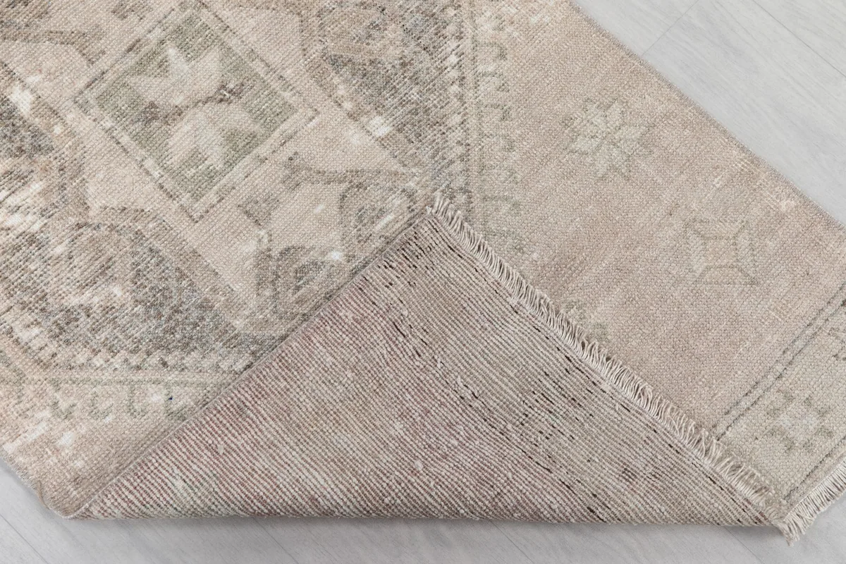 Underside view of the hand-knotted wool pile on cotton foundation