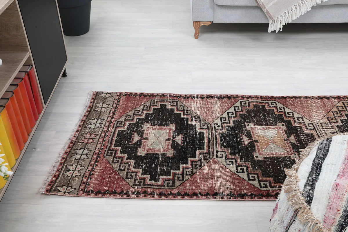 Angled view of the runner rug showing its full length and the consistent geometric design
