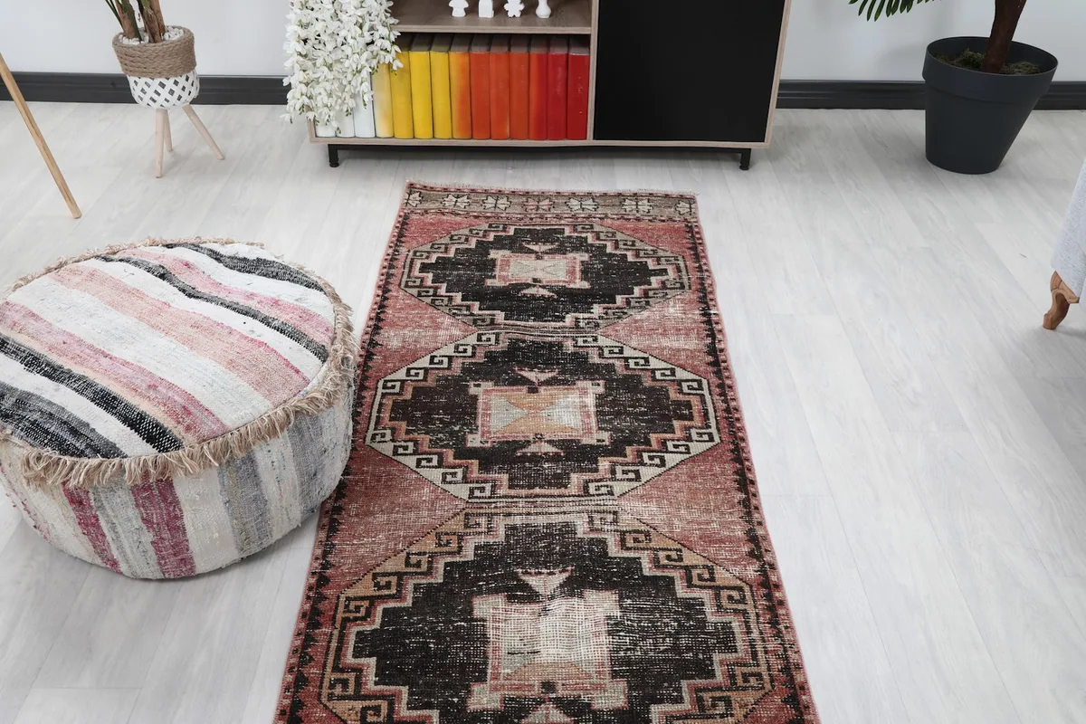 Overhead view of the vintage runner rug in a room, showcasing its length and pattern