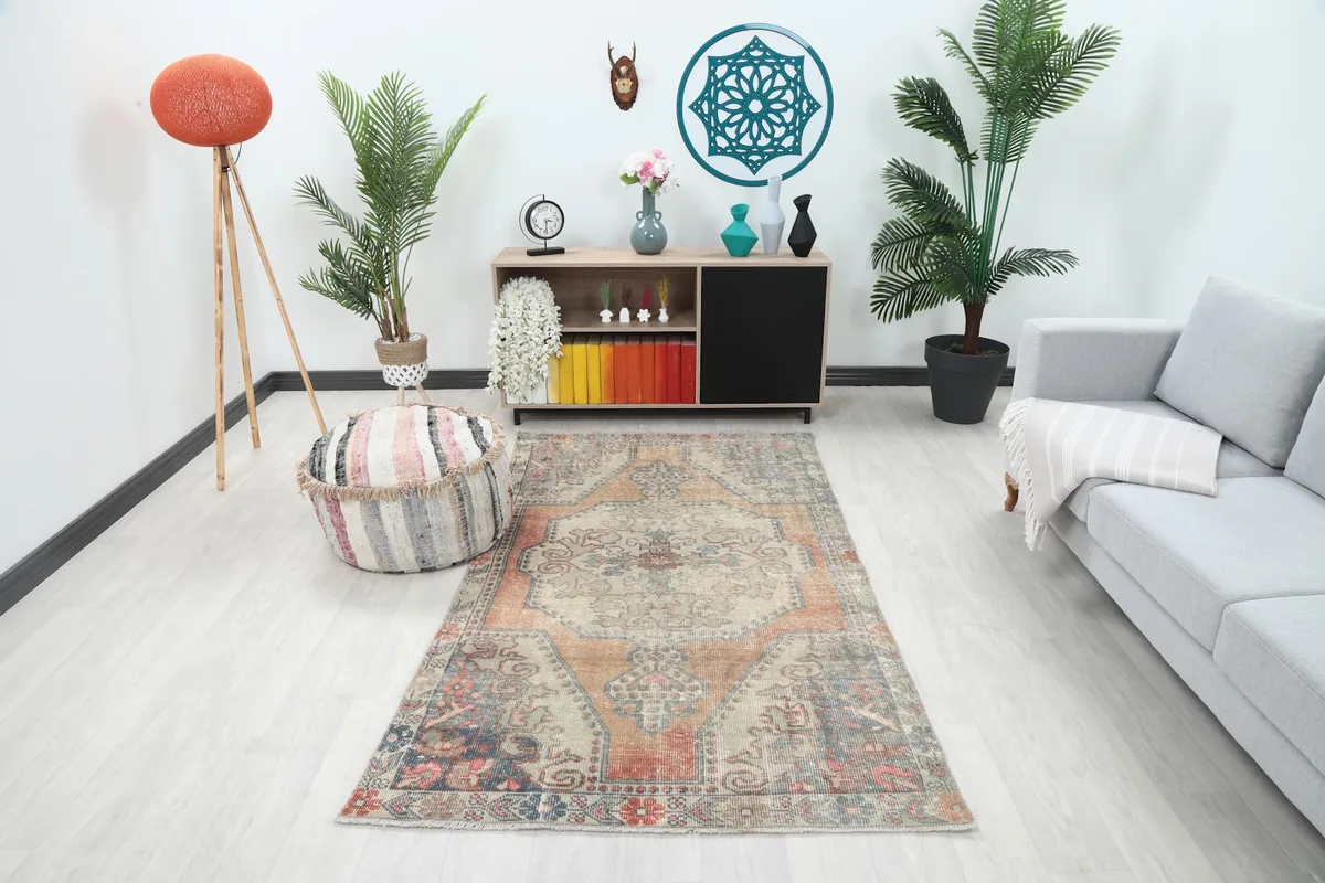 Vintage rug in a contemporary living room setting, showing its overall size and color