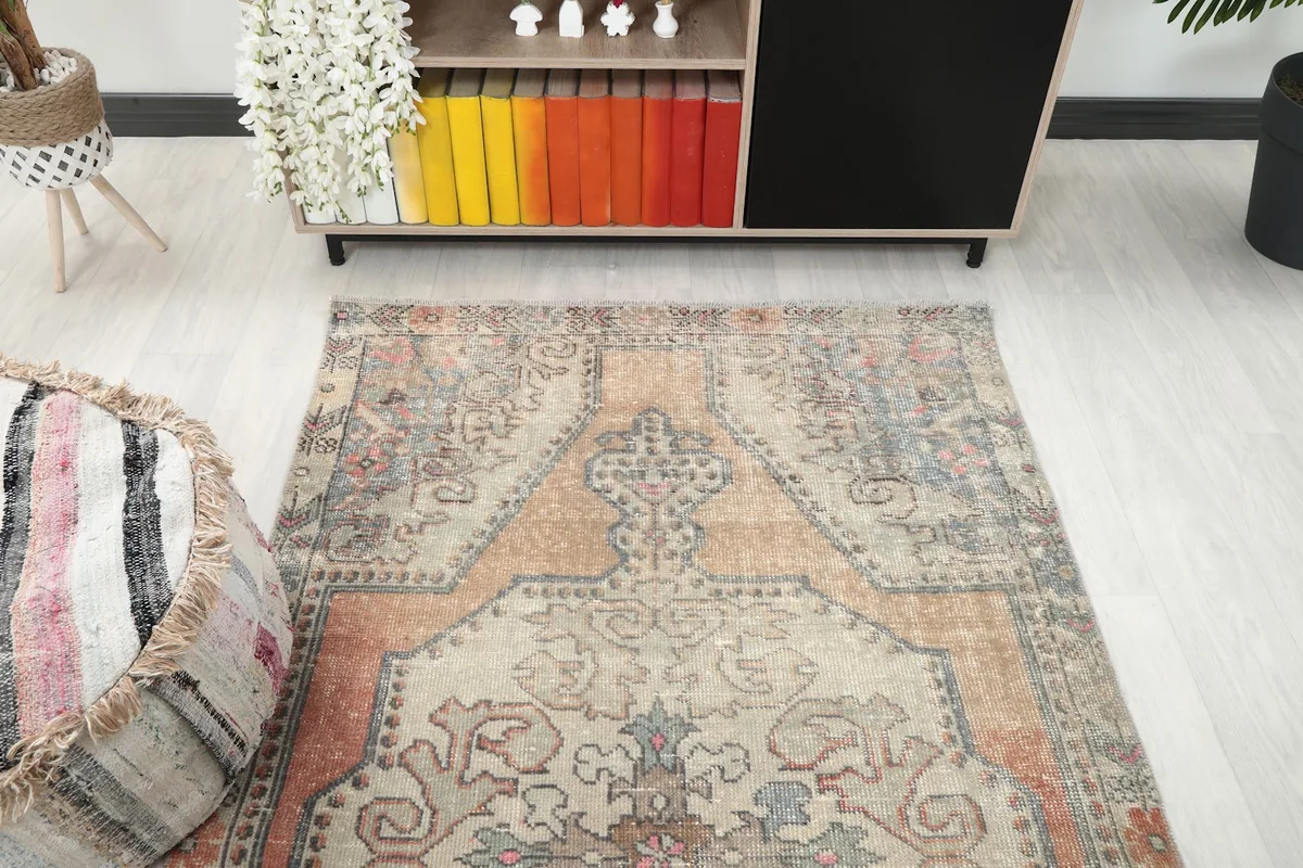 Overhead perspective of the rug, showcasing its geometric medallion and surrounding patterns