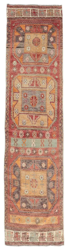 Full overhead view of the rust, beige, and gray vintage Anatolian runner rug with tribal geometric patterns