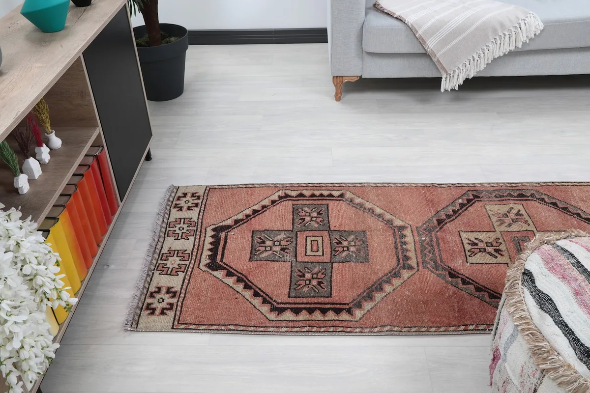 Partial view of the rug in a room setting, showing its texture and color variation