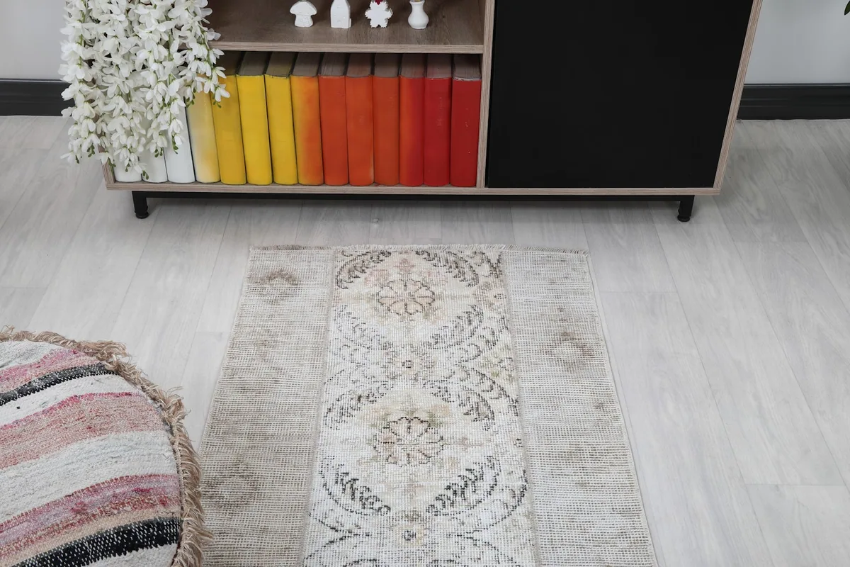 Overhead view of the rug in the room, focusing on the central design and its interaction with the surrounding decor.
