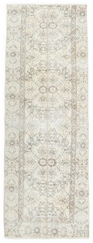 Full overhead view of the 2'6" x 7'1" ivory and gray vintage runner rug.