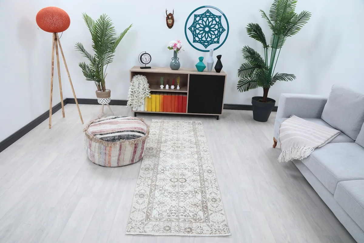 Runner rug displayed in a modern living space, showing its scale and pattern.